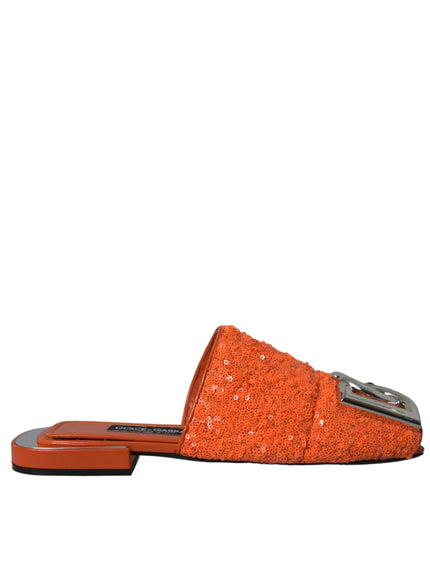 an orange slipper with a silver buckle