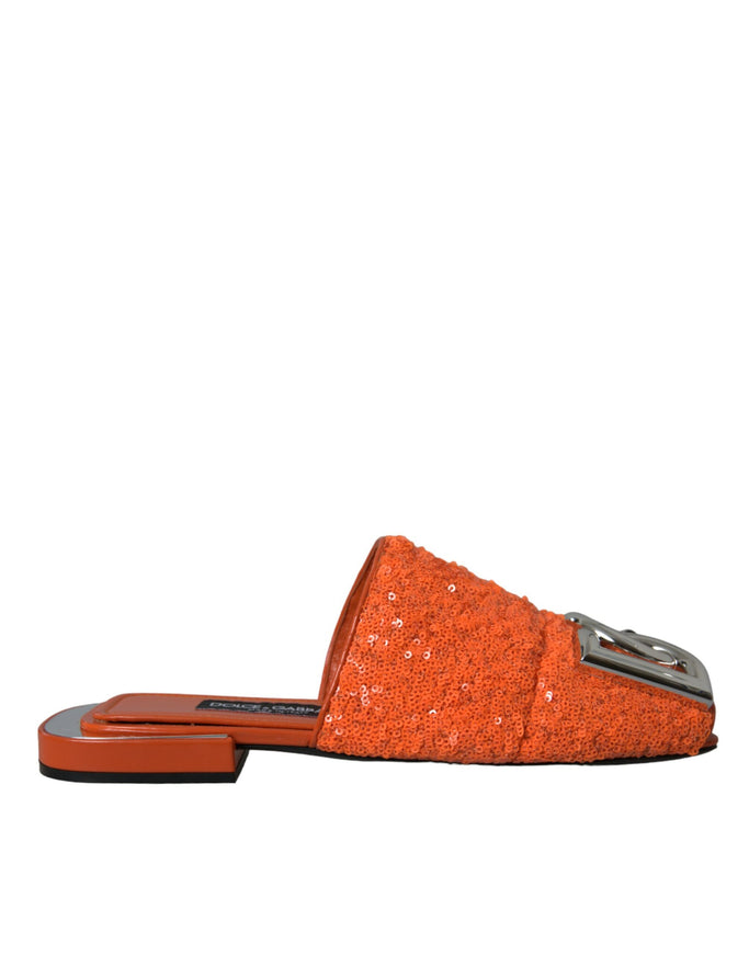 an orange slipper with a silver buckle