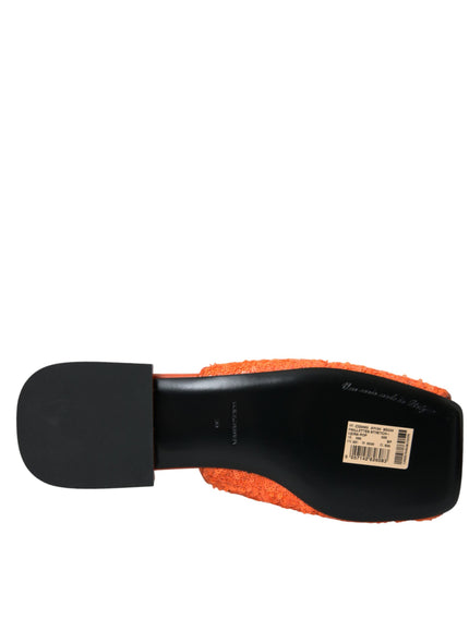 a close up of a black and orange shoe