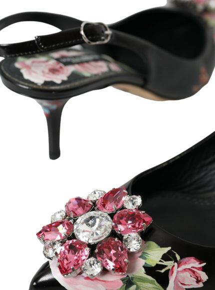 a pair of black shoes with pink flowers on them