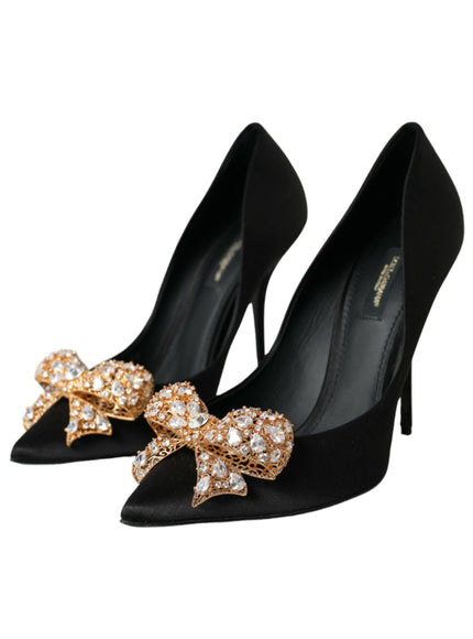 a pair of black high heels with bows