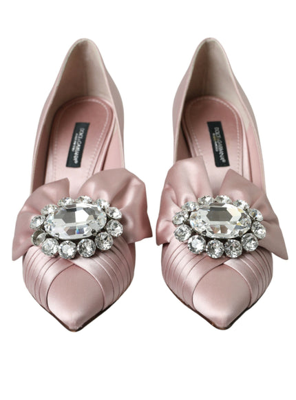 a pair of pink shoes with a jewel buckle