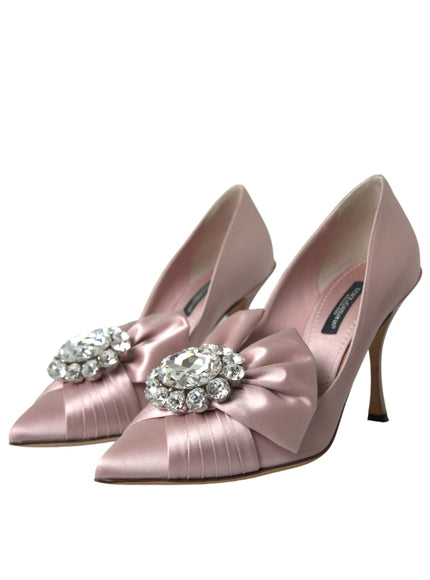 a pair of pink high heels with a bow