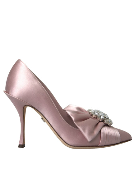 a pink high heeled shoe with a bow