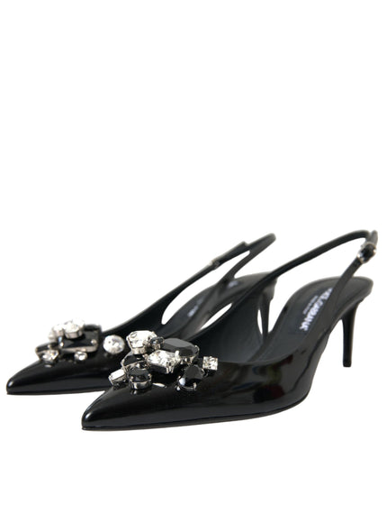 a pair of black high heeled shoes with crystal decorations