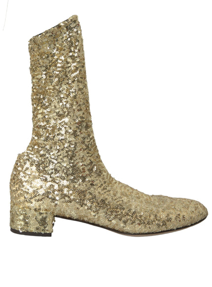 a pair of gold sequin boots on a white background