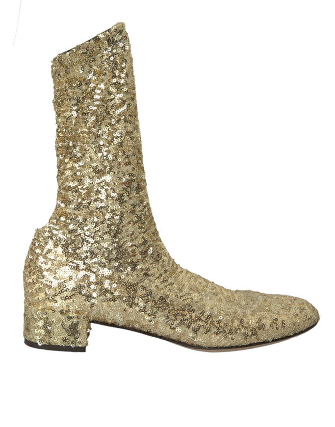 a pair of gold sequin boots on a white background