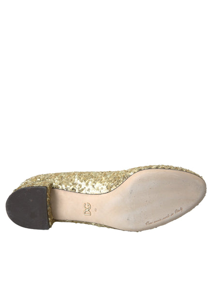 a woman's shoe with gold sequins