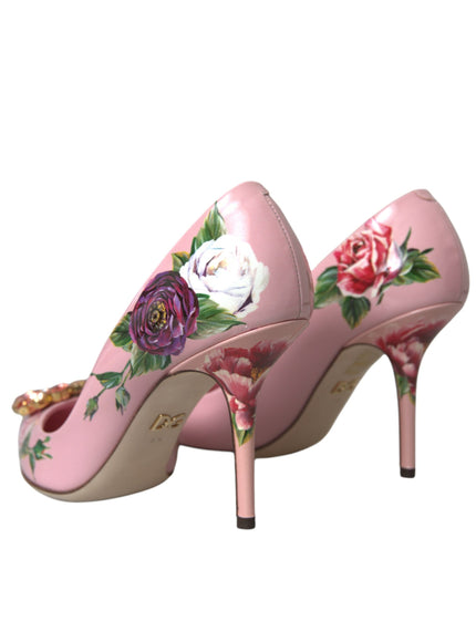 a pair of pink shoes with roses painted on them