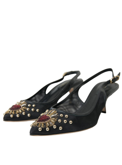 a pair of black shoes with gold and red beads