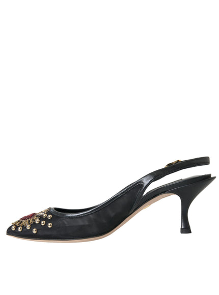 a pair of black shoes with gold studs