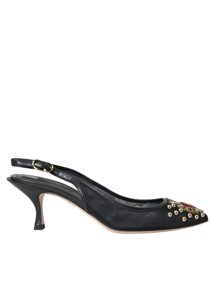 a pair of black high heels with gold studs