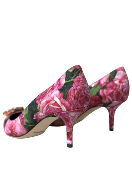 a pair of pink floral shoes on a white background