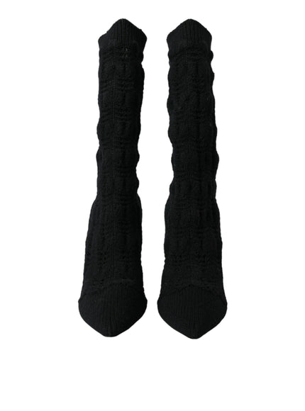 a pair of black socks on a white background