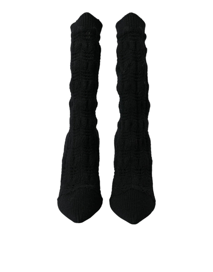 a pair of black socks on a white background