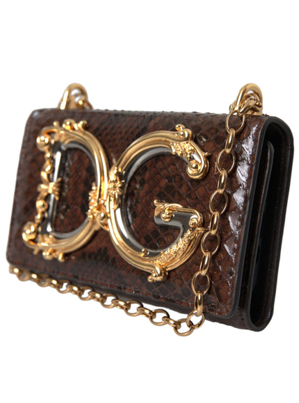 a brown purse with gold chains hanging from it