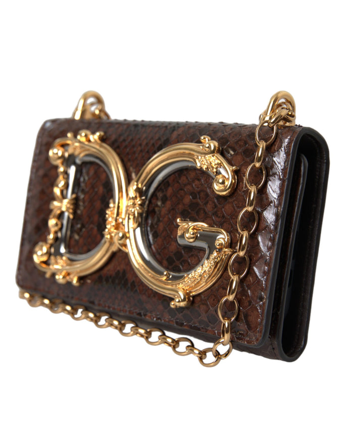 a brown purse with gold chains hanging from it