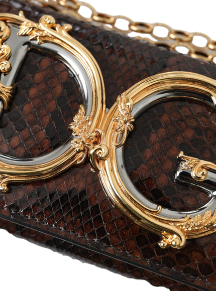 a brown snake skin purse with gold accents