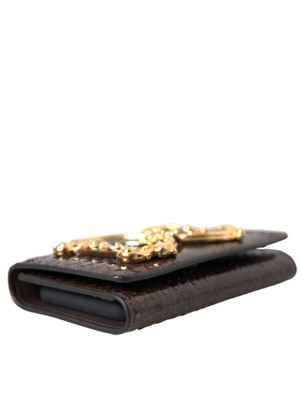 a wallet with a gold chain on top of it