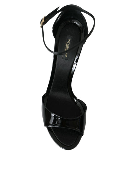 a woman's black high heeled sandal