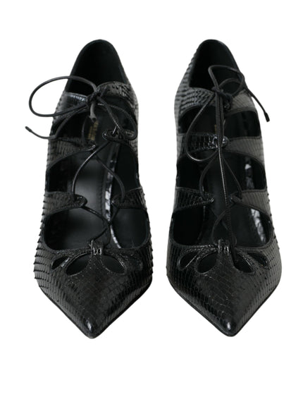 a pair of black shoes with laces on them