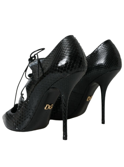 a pair of black high heels with laces