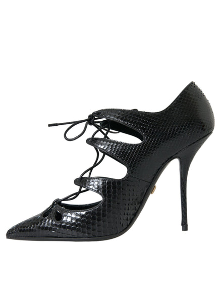 a black high heeled shoe with laces