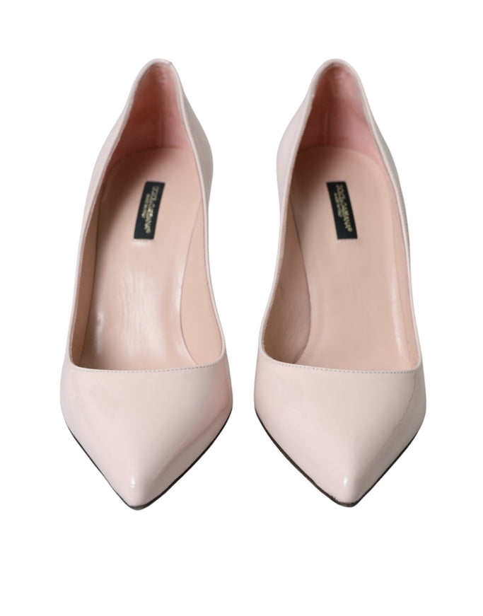 a pair of pink high heels on a white background