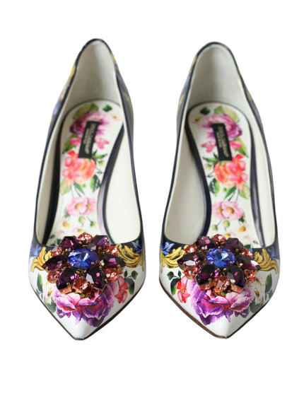 a pair of shoes with flowers painted on them