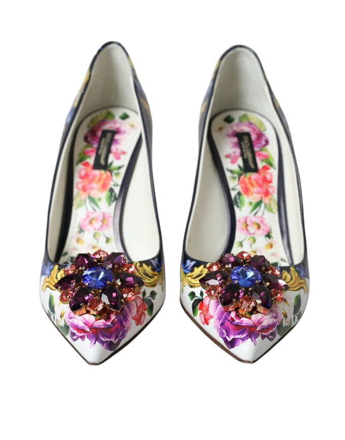 a pair of shoes with flowers painted on them