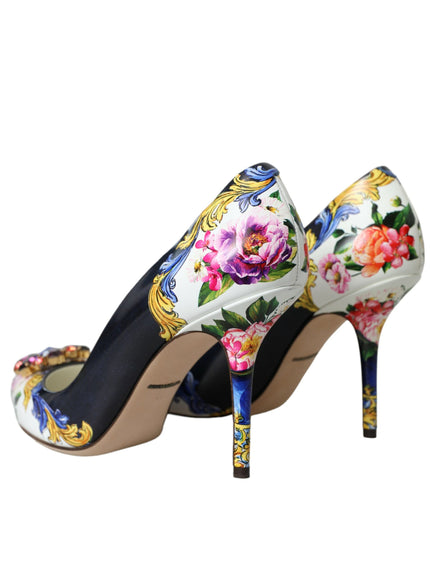 a pair of high heels with flowers painted on them