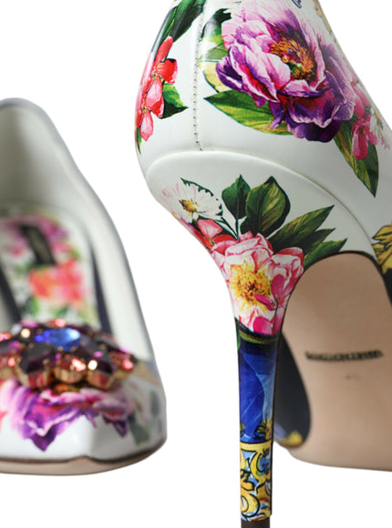 a pair of shoes with flowers painted on them