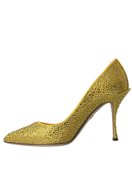 a gold high heeled shoe on a white background