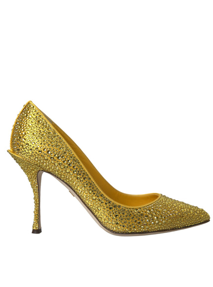 a gold high heeled shoe with a pointed toe