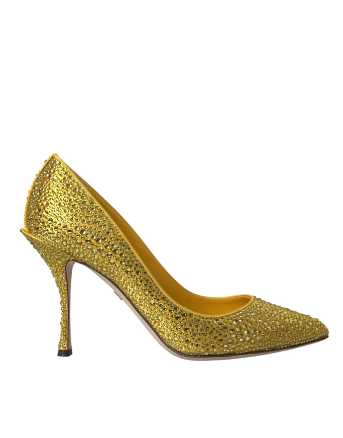 a gold high heeled shoe with a pointed toe