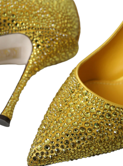 a pair of yellow high heels with gold sequins