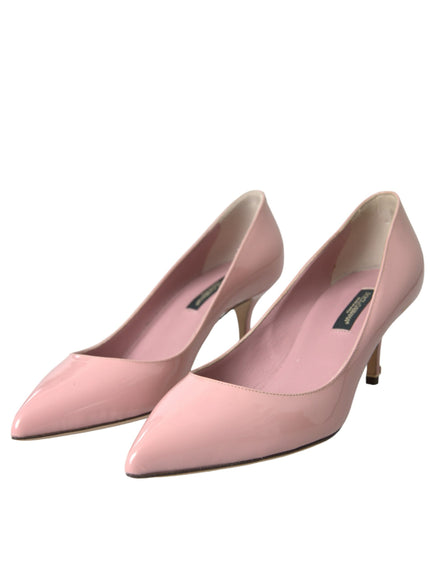 a pair of pink high heels on a white background