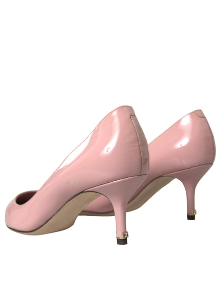 a pair of pink shoes on a white background