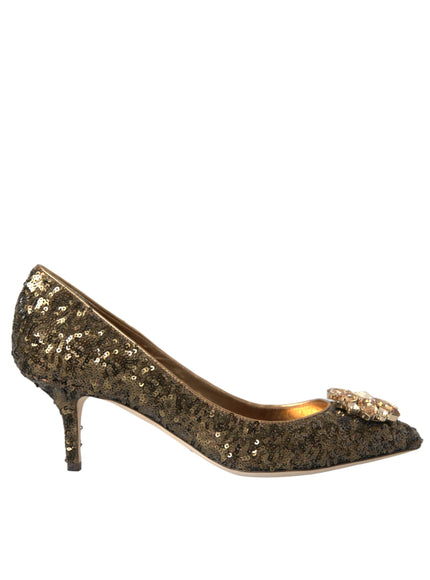 a women's shoe with gold sequins and a bow