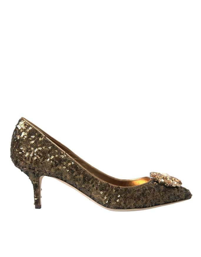 a women's shoe with gold sequins and a bow