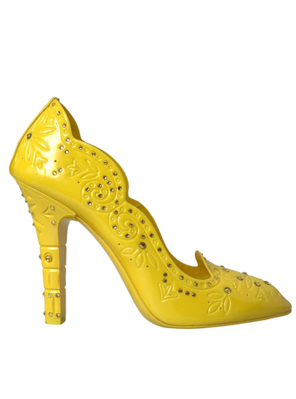 a yellow high heeled shoe with studded details