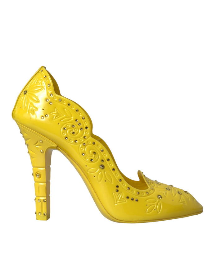 a yellow high heeled shoe with studded details