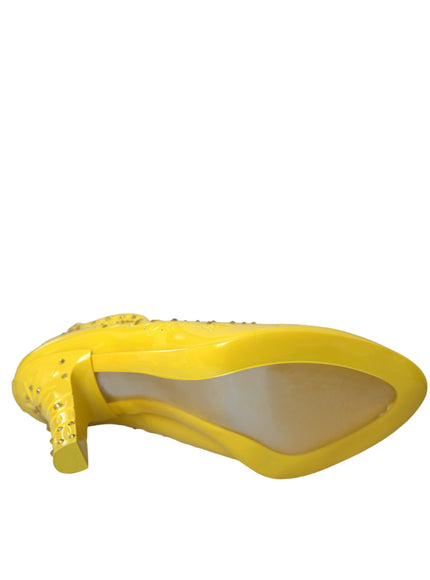 a pair of yellow shoes on a white background