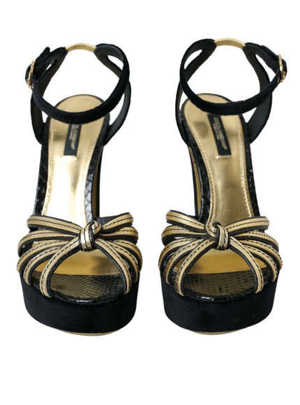 a pair of black and gold high heels