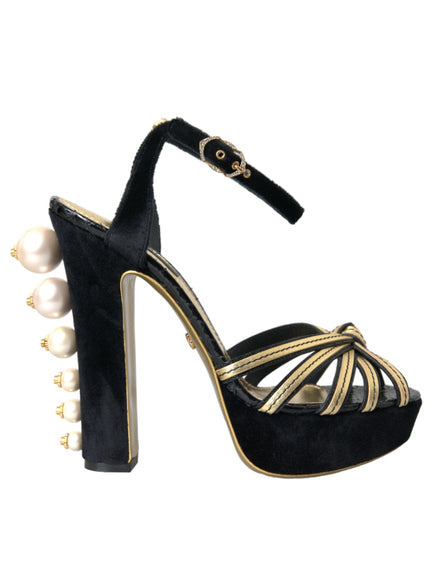 a black and gold high heeled shoe with pearls