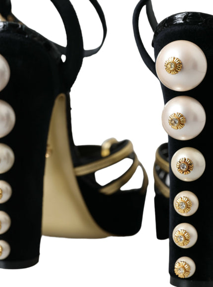 a pair of high heeled shoes with pearls on them