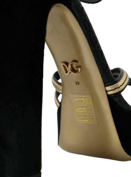 a pair of black and gold high heels