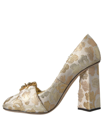 a women's shoe with a gold flower on the heel