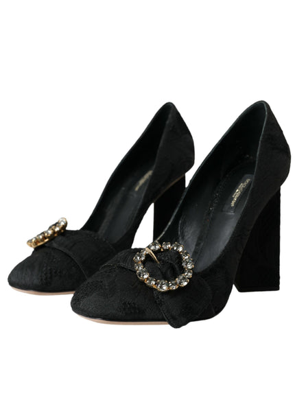 a pair of black high heels with a gold buckle