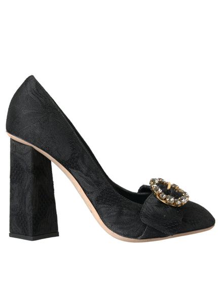 a pair of black high heels with a gold buckle